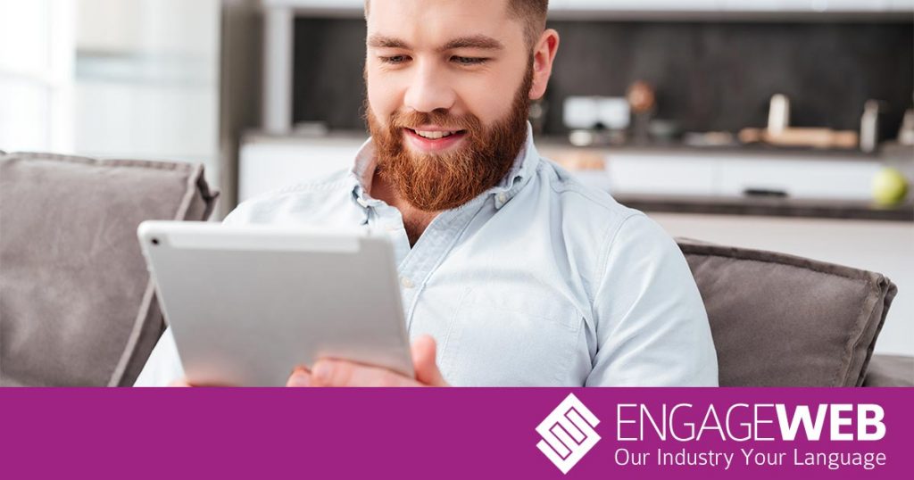 Man Reading on Tablet