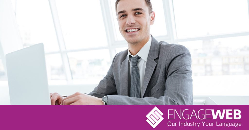 Man on computer smiling