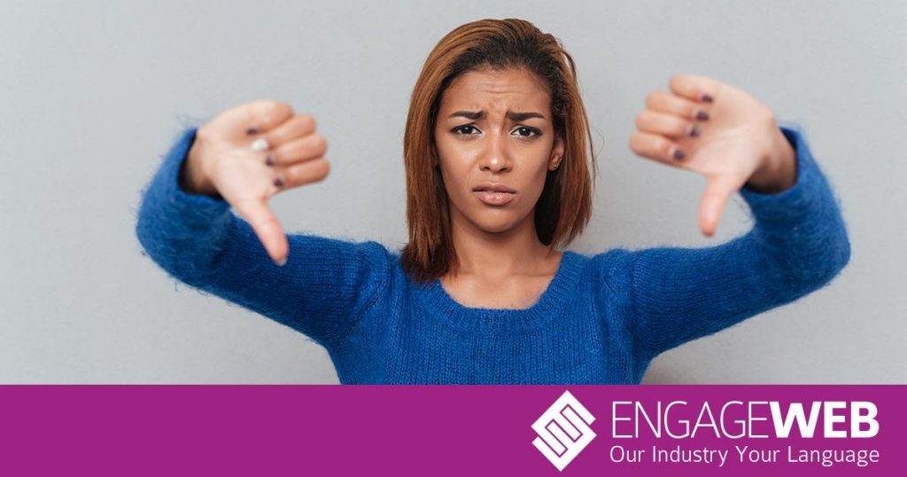 Woman with thumbs down