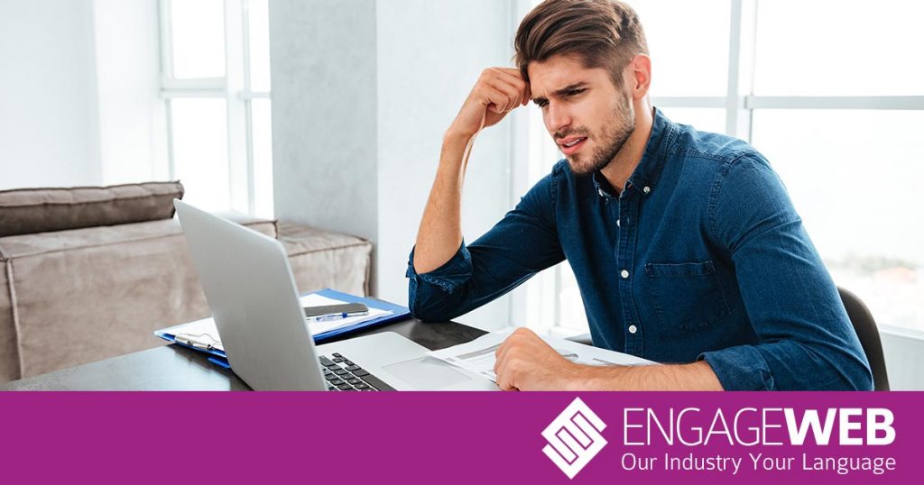 Confused man at laptop