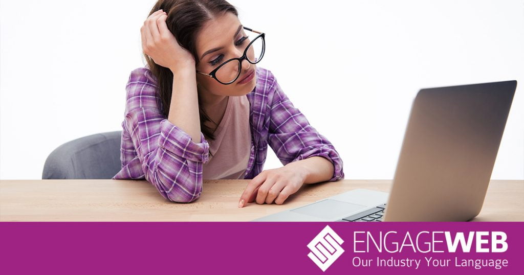 Woman bored on laptop