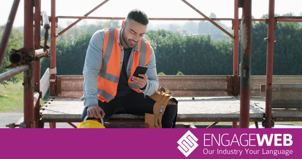 Tradesman using mobile phone