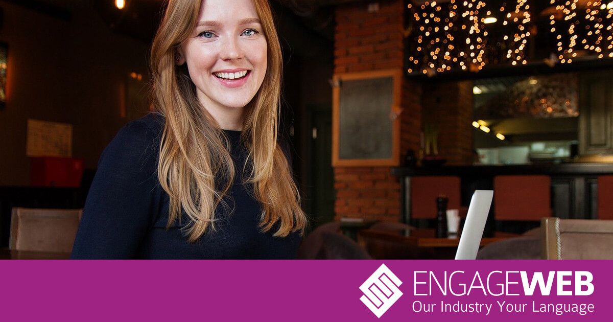 Woman smiling on laptop